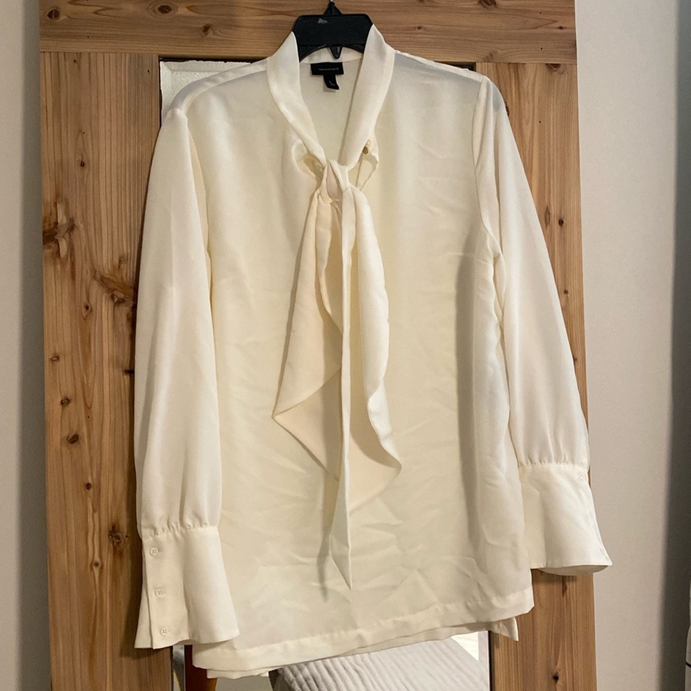 Size L beige blouse with tie detail.